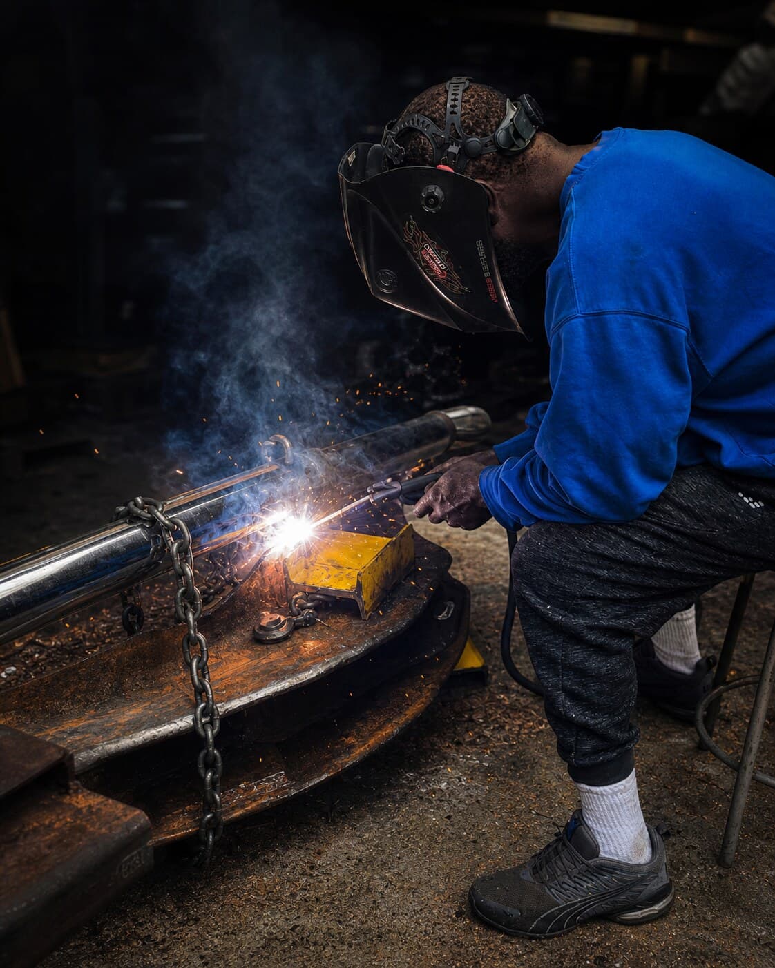 Master machinist welding a heavy equipment component at Southern Machinist Company